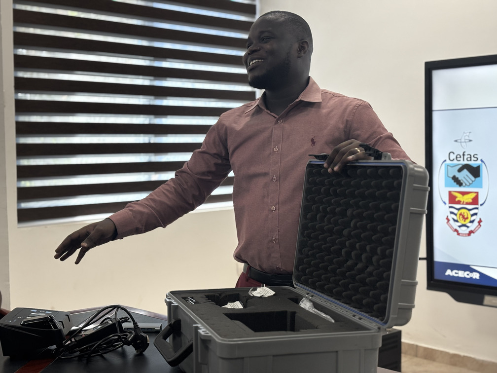 Albert Koomson making a presentation of his sample collection tool