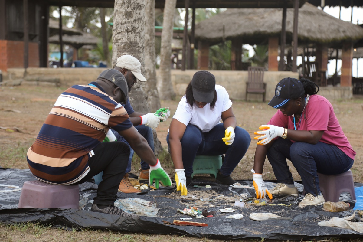Participants engaging in marine litter assessment exercises